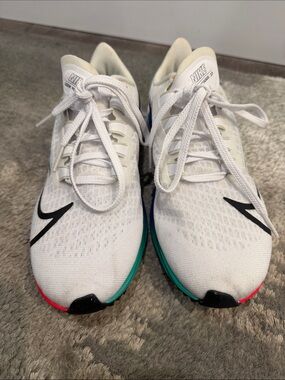 Nike White Running Sneakers with Black Swoosh and Teal & Pink Accents